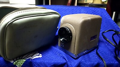 #ad #ad antique AT 9 minolta Mini 35 slide projector with special case projector $10.00