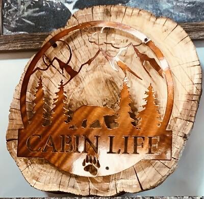 #ad Rustic cabin’recessed’ Metal on wood approximately 20in In circumference decor￼ $120.00
